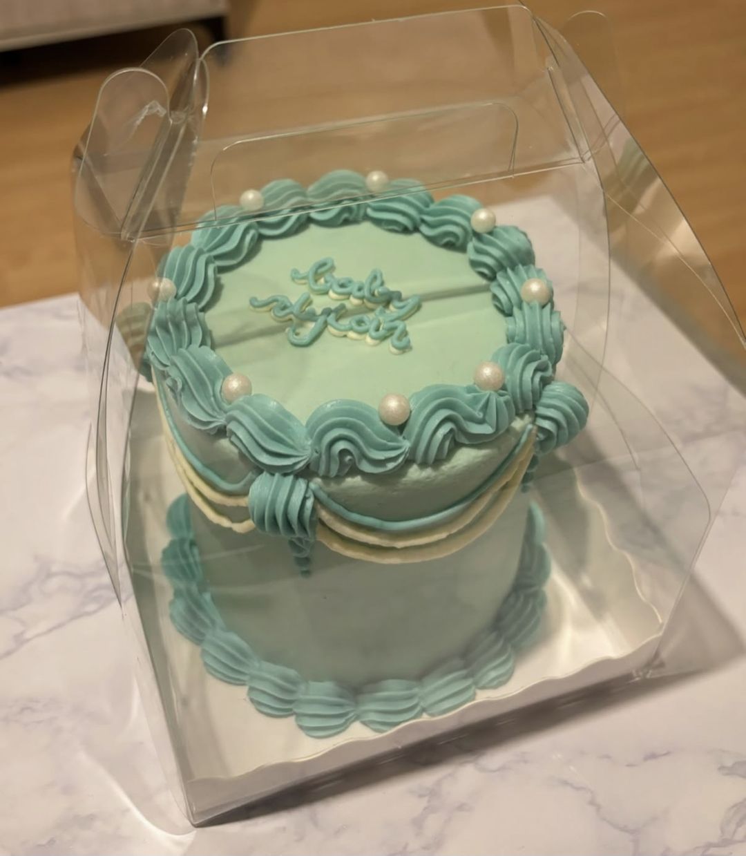 Teal vintage bento with white garlands, pearls and “Baby Dylan” on top (photo 2 of 2)