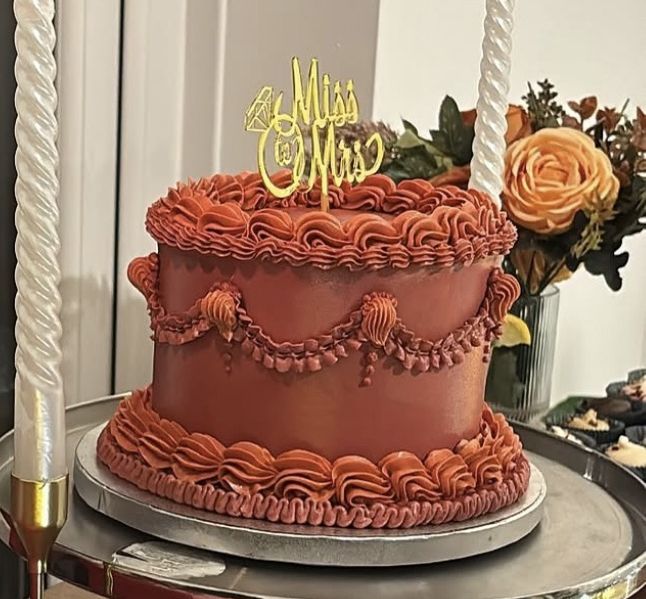 Terracotta vintage cake with swags and ruffles and a gold “Miss to Mrs” topper (photo 2 of 2)